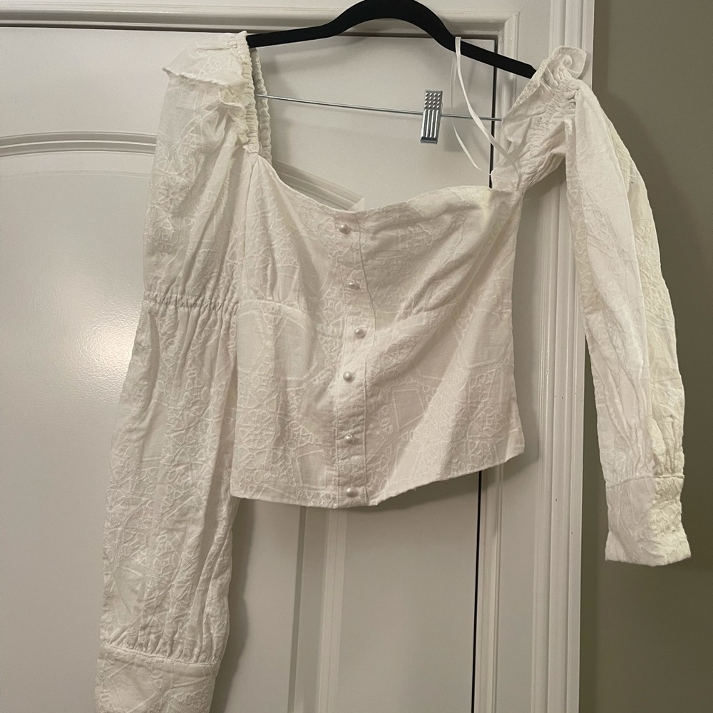 White lace off the shoulder top with preal details!